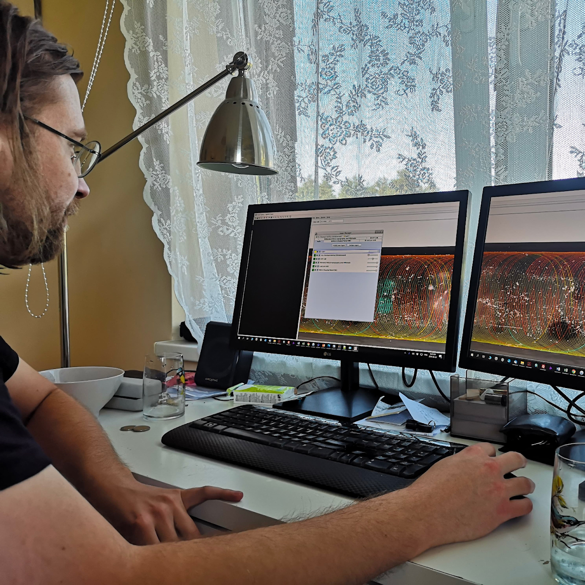 Deividas, Data Specialist at MailerLite working with a satellite orbiting Mars