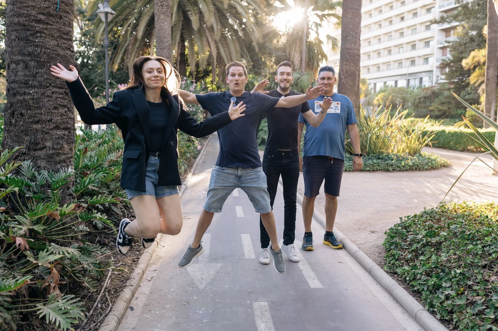 4 people jumping together