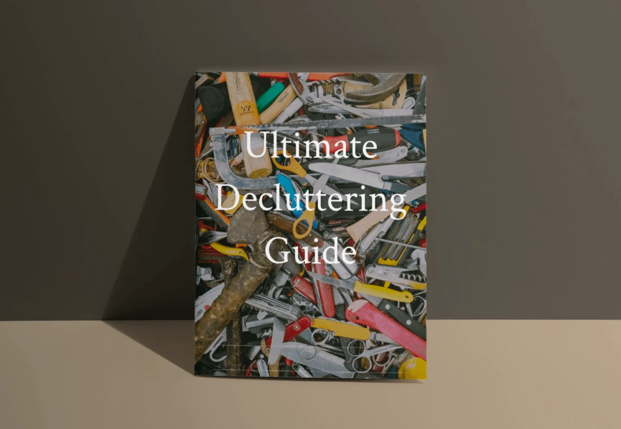 ultimate decluttering guide on a cover book